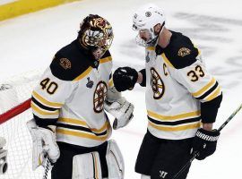 Bruins' goalie Tuukka Rask is congratulated by teammate Zdeno Chara after winning Game 6 of the Stanley Cup Finals in St. Louis. (Image: Getty)