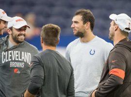 Indianapolis Colts QB Andrew Luck (center) chats with Cleveland Browns players and coaches during warmups of a preseason game. (Image: Trevor Ruszkowski/USA Today Sports)