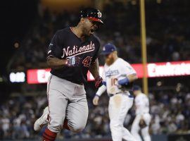 An enthusiastic Washington Nationals 2B Howie Kendrick rounds the bases after hitting a grand slam in extra innings to eliminate the LA Dodgers in Game 5 of the 2019 NLDS at Dodger Stadium. (Image: Marcio Jose Garcia/AP)