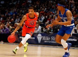 Auburn guard Samir Doughty (10) blows by Saint Louis guard Jordan Goodwin (0) in Auburn, Alabama. (Image: Butch Dill/AP)