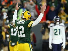 Green Bay Packers QB Aaron Rodgers celebrates a touchdown during a victory over the Seattle Seahawks in the NFC Divisional round in Green Bay, WI. (Image: Dylan Buell/Getty)