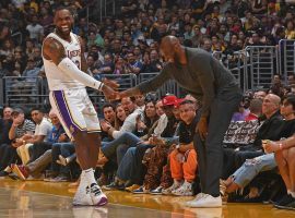 LeBron James joking with Kobe Bryant during a LA Lakers game at Staples Center in LA. (Image: Getty)