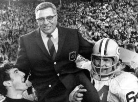 Green Bay Packers players carry head coach Vince Lombardi off the field after a victory over the Kansas City Chiefs in Super Bowl I. (Credit: AP)