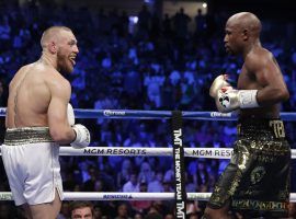 Conor McGregor (left) believes thereâ€™s a chance he could fight a rematch in the boxing ring with Floyd Mayweather Jr. (right). (Image: AP)