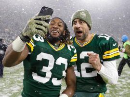 Packers running back Aaron Jones, left, has given quarterback Aaron Rodgers a reliable running game, and could be the deciding factor in the Seattle-Green Bay NFC Divisional Playoff game Sunday at Lambeau Field. (Image: AP)