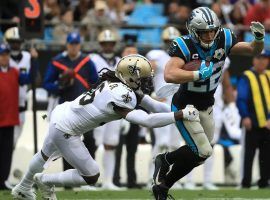 Carolina Panthers RB Christian McCaffrey evades a tackler on the New Orleans Saints at the Superdome. (Image: Streeter Lecka/Getty)