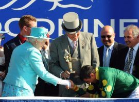 Queen Elizabeth II presents winning jockey Eurico Rosa Da Silva with the Queen's Plate at Woodbine in 2010. (Image: Michael Burns Photo Ltd.)