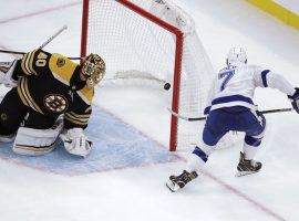 Tampa Bay Lightning winger Mathieu Joseph scores a goal against Boston Bruins goalie Tukka Rask. (Image: Elise Amendola/AP)