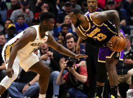 New Orleans Pelicans rookie Zion Williamson guards LeBron James of the LA Lakers at the Smoothie King Center in NOLA. (Image: Porter Lambert/Getty)