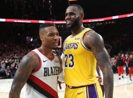 Portland Trail Blazers star Damian Lillard and LeBron James of the LA Lakers at Staples Center in 2019. (Image: Porter Lambert/Getty)