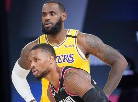 LA Lakers star LeBron James and Portland Blazers guard Damian Lillard during Game 2 in Orlando, FL. (Image: AP)