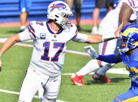 Josh Allen of the Buffalo Bills stiff arms LA Rams CB Troy Hill. (Image: Mark Konezny/USA Today Sports)