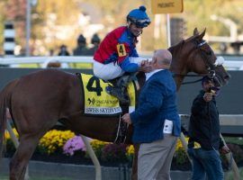 Swiss Skydiver trainer Kenny McPeek congratulates jockey Robby Albarado for winning the 145th Preakness Stakes. That complicates McPeek's Breeders' Cup plans for his star filly. (Image: Mitch Stringer/USA TODAY)