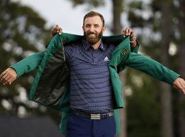 Dustin Johnson, seen here sliding on the winnerâ€™s green jacket after a victory at the 2020 Masters in Augusta, Georgia, comes into the 2021 Masters as the consensus favorite. (Image: Matt Slocum/AP)