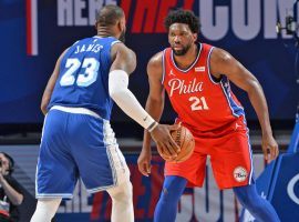 Joel Embiid of the Philadelphia 76ers defends LA Lakers star LeBron James at the Wells Fargo Center in Philadelphia. (Image: David Dow/Getty)