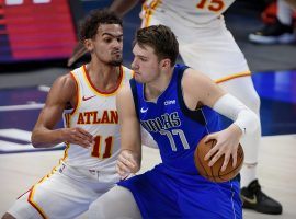 Trae Young of the Atlanta Hawks defends Dallas Mavericks star Luka Doncic, but couldn't stop Luka from tallying a seventh triple-double this season. (Image: Jerome Miron/USA Today Sports)