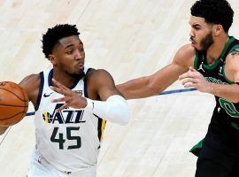 Donovan Mitchell, Utah Jazz guard seen here driving against Boston Celtics star Jayson Tatum, leads the red-hot Utah Jazz to a 16-1 record over their last 17 games. (Image: Getty)