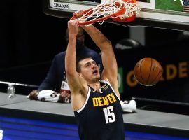 Nikola Jokic, seen here dunking in a game for the Denver Nuggets, has become the new favorite to win the MVP this season. (Image: Winslow Townsend/USA Today Sports)