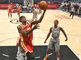 Rajon Rondo, seen here shooting a layup for the Atlanta Hawks while Lou Williams of the LA Clippers looks on, was involved in a trade for Williams just before the trade deadline expired. (Image: Adam Pantozzi/Getty)