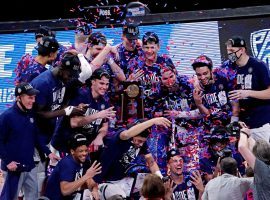 Gonzaga Bulldogs, seen here celebrating their victory in the Elite 8 to snag a spot in the 2021 Final Four, are the consensus betting favorites to win March Madness. (Image: Porter Lambert/Getty)