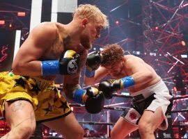 Jake Paul (left) delivered a brutal first-round knockout over Ben Askren (right) in their boxing match on Saturday night. (Image: Getty)