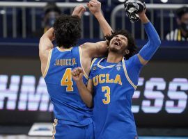 Jaime Jaquez Jr. (4) and Johnny Juzang (3), seen here celebrating an overtime victory for UCLA over Alabama in the Sweet 16, are the primary scorers for the Bruins heading into the Final Four. (Image: Michael Conroy/AP)