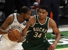 Giannis 'Greek Freak' Antetokounmpo (right) from the Milwaukee Bucks defends Brooklyn Nets big man Kevin Durant during a game among two of the premier teams in the Eastern Conference. (Image: Getty)