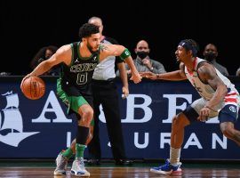 Boston Celtics star Jayson Tatum, seen here defended by Bradley Beal of the Washington Wizards. The Wizards and Celtics meet in the play-in tournament to determine the #7 seed in the Eastern Conference playoffs. (Image: Brian Babineau/Getty)