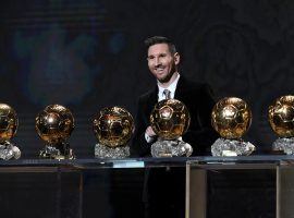 Lionel Messi poses with his six 'Ballon d'Or' trophies. (Image: forbes.com)