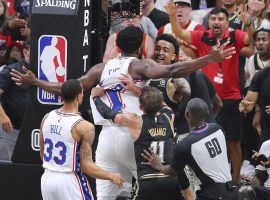 Joel Embiid from the Philadelphia 76ers and John Collins of the Atlanta Hawks engage in extra circular activity after they were tangled up underneath the basket, while Atlantaâ€™s Trae Young (11) tries to intervene during Game 6 in Atlanta. (Image: Getty)