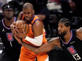 Chris Paul from the Phoenix Suns fights for a loose ball against Paul George of the LA Clippers in the Western Conference Finals. (Image: Porter Lambert/Getty)