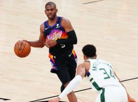 Giannis 'Greek Freak' Antetokounmpo from the Milwaukee Bucks defends Chris Paul of the Phoenix Suns during Game 1 of the 2021 NBA Finals. (Image: Porter Lambert/Getty)