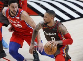 Damian Lillard of the Portland Trail Blazers blows by Ben Simmons from the Philadelphia 76ers, but could the two swap teams after Dame requested as a trade? (Image: Soobum Im/USA Today Sports)