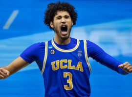 Johnny Juzang celebrates an overtime victory for UCLA during the 2020 March Madness college basketball tournament. (Image: Mark J. Rebilas/USA Today Sports)