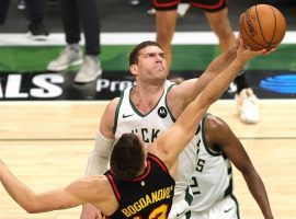 Brook Lopez of the Milwaukee Bucks grabs a rebound over Bogdan Bogdanovic of the Atlanta Hawks during a victory in Game 5 of the Eastern Conference Finals. (Image: Getty)