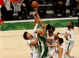 Four members of the Phoenix Suns try to defend Giannis â€˜Greek Freakâ€™ Antetokounmpo from the Milwaukee Bucks in Game 3 of the 2021 NBA Finals at Fiserv Forum in Milwaukee. (Image: Jeff Hansich/USA Today Sports)