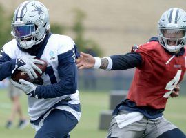 Dallas Cowboys QB Dak Prescott hands the ball off to RB Ezekiel Elliot during training camp on the first episode of the new season of HBO Hard Knocks. (Image: HBO)