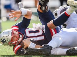 Mac Jones, rookie quarterback from the New England Patriots, is sacked by the New Orleans Saints last week at Foxboro. (Image: Marco Esquandoles/Getty)