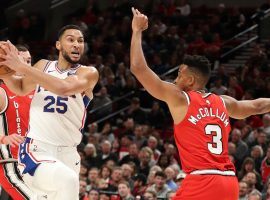 CJ McCollum from the Portland Trail Blazers defends Ben Simmons of the Philadelphia 76ers. (Image: Getty)