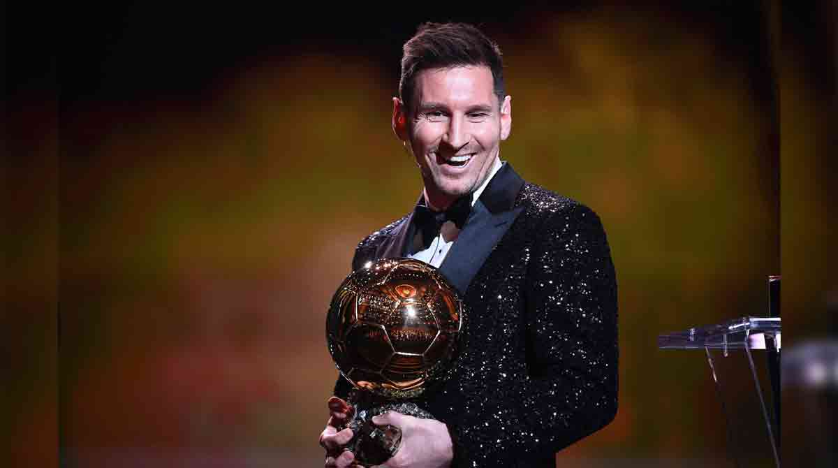 Lionel Messi with the Ballon d'Or trophy