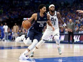 Spencer Dinwiddie (26) from the Dallas Mavs drives to the hole against Royce Oâ€™Neal from the Utah Jazz in Game 1 of the 2022 NBA Playoffs. (Image: Tom Pennington/Getty)