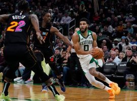 Bam Adebayo and Jimmy Butler (22) from the Miami Heat double team Jayson Tatum from the Boston Celtics. (Image: Getty)