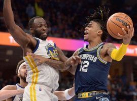 Draymond Green from the Golden State Warriors attempts to slow down Ja Morant of the Memphis Grizzlies during a sensational Game 2 in which he scored 47 points. (Image: Getty)