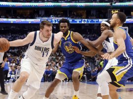 Luka Doncic from the Dallas Mavs drives to the basket against Steph Curry of the Golden State Warriors in Game 4 at the American Airlines Center. (Image: Getty)