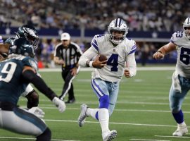 Dak Prescott from the Dallas Cowboys runs toward the end zone against the Philadelphia Eagles in an NFC East Division battle last season. (Image: Porter Lambert/Getty)