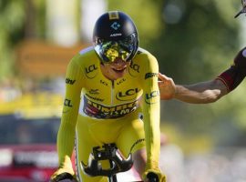 Wout van Aert (Jumbo-Visma) congratulates teammate Jonas Vingegaard for surviving Stage 20 and locking up a victory in the 2020 Tour de France. (Image: AP)