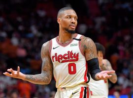 Damian Lillard from the Portland Trail Blazers shrugs his shoulders after he knocked down a "logo shot" deep 3-pointer. (Image: Getty)